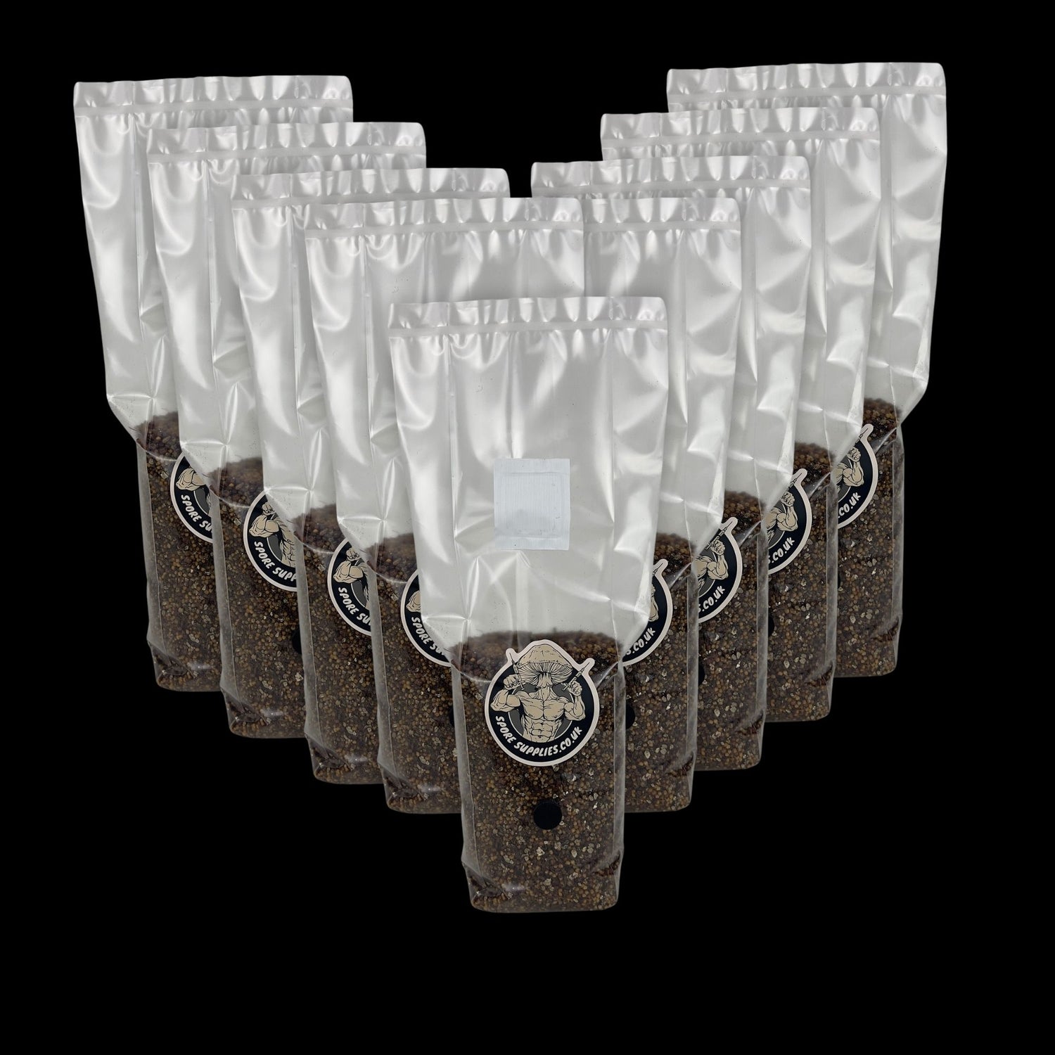 a collection of 1kg sterile all in one mushroom grow bags for wholesale in front of a black background