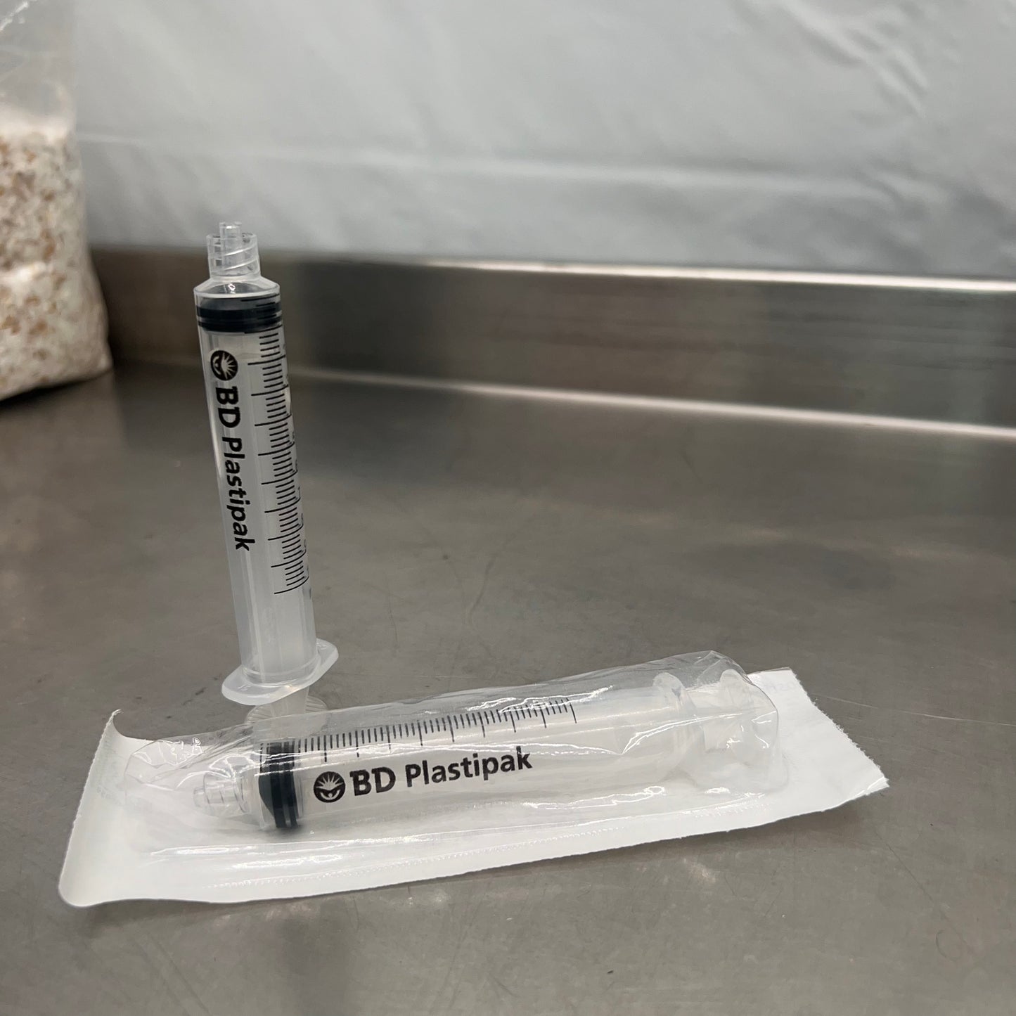 sterile BD Plastipak 10ml luer lock syringe in individual packaging