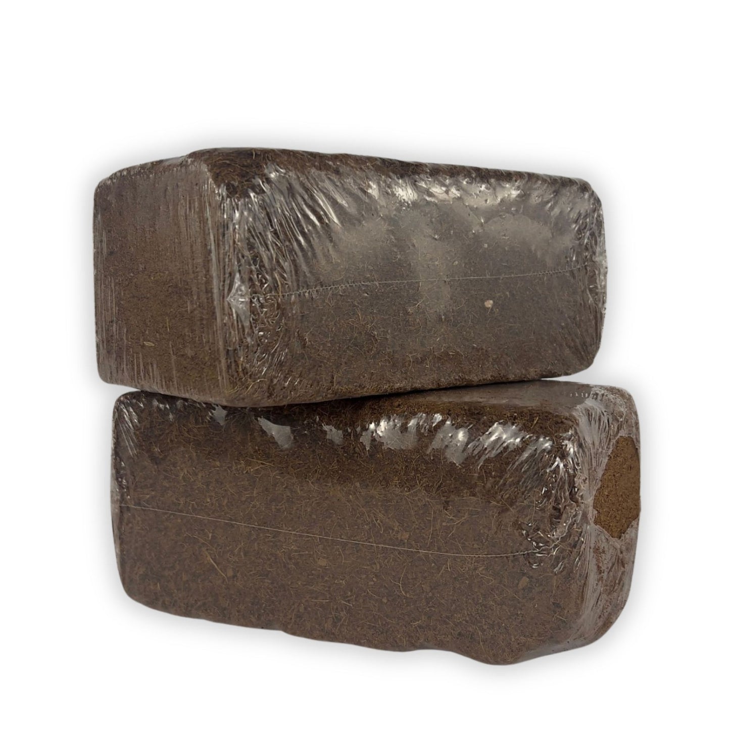Two brown coco coir bricks stacked on top of each other against a white background.
