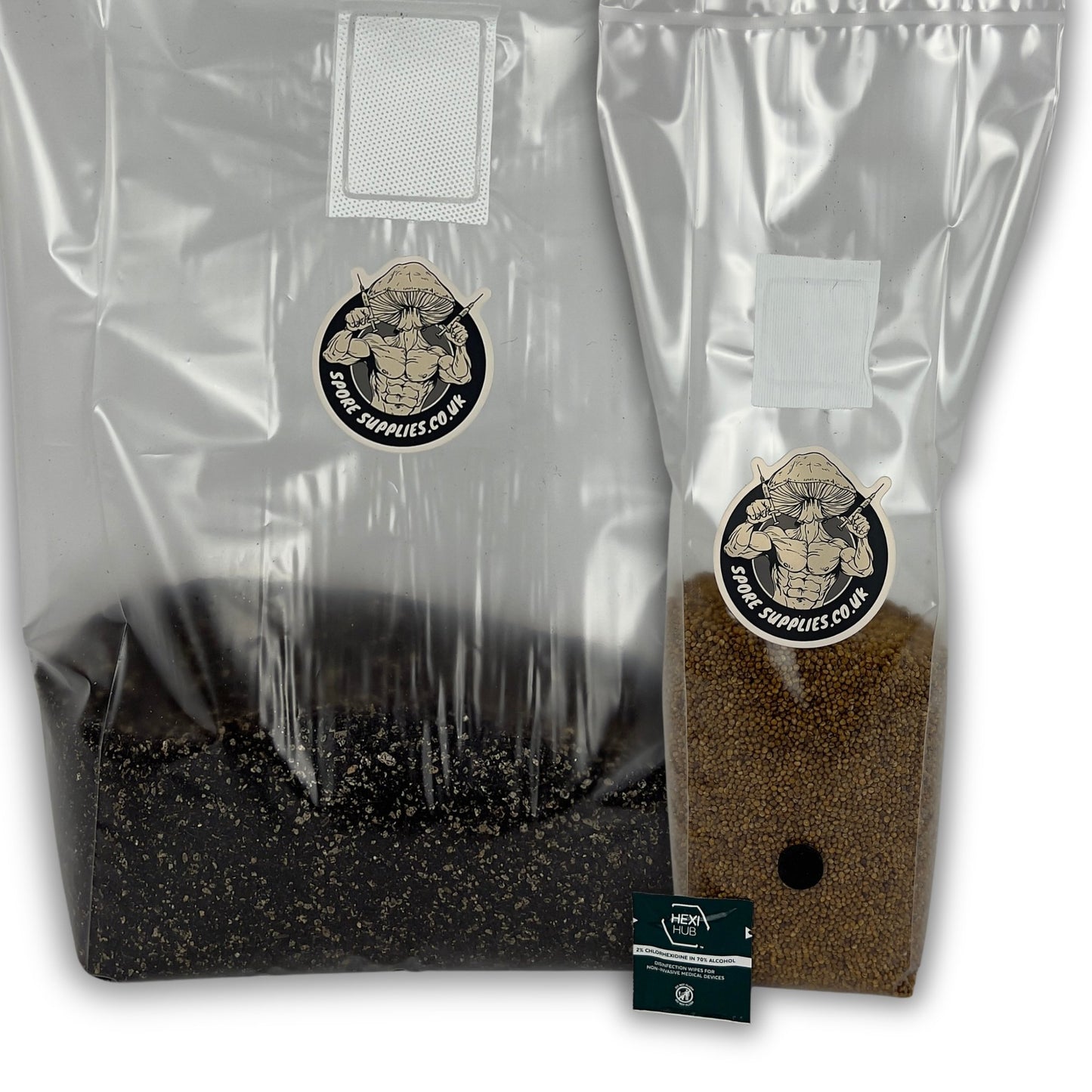 Two clear plastic grow bags filled with substrate, one black and one brown, with a small branded card in front, photographed on a white background.