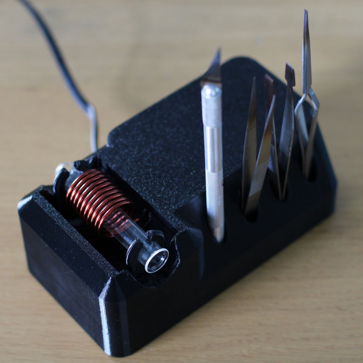 black induction steriliser for mycology work by funguy equipment with scalpel tools in holder