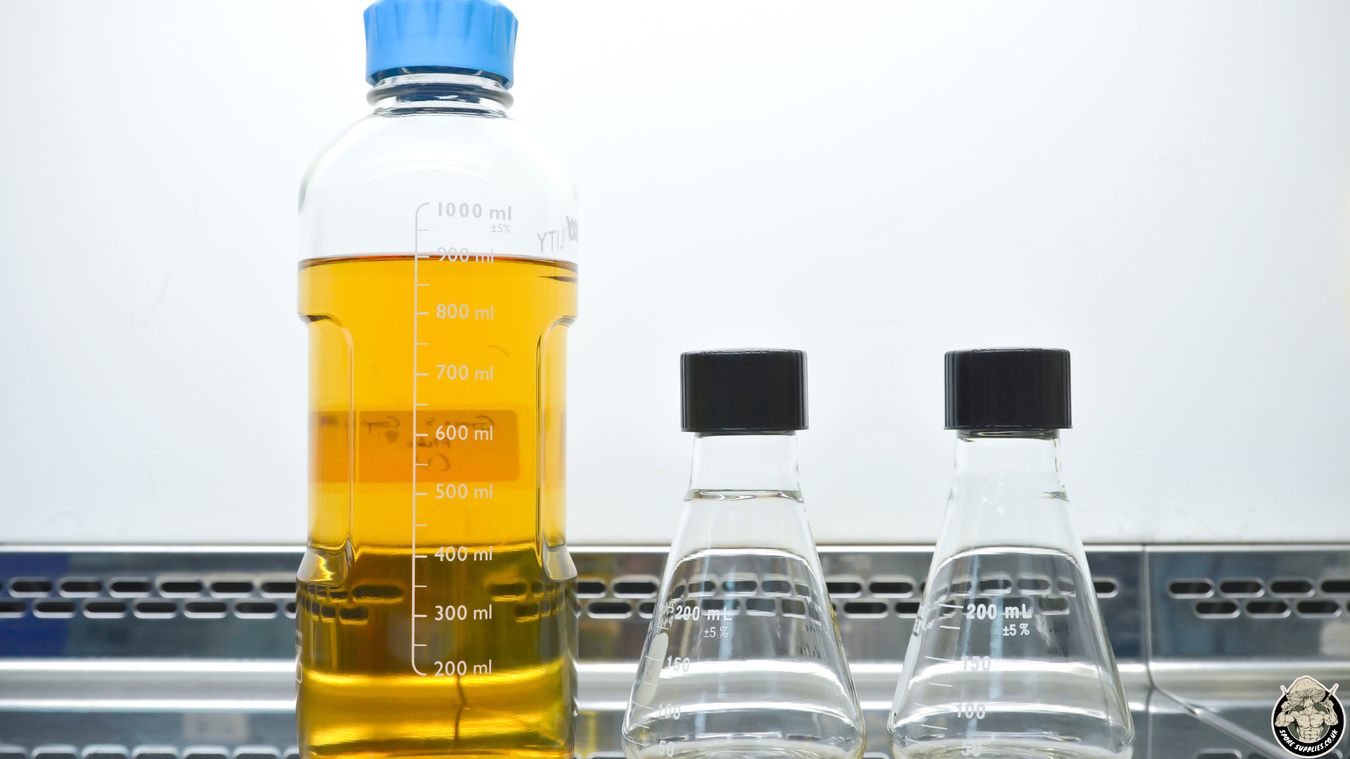 laboratory bottles containing liquid media