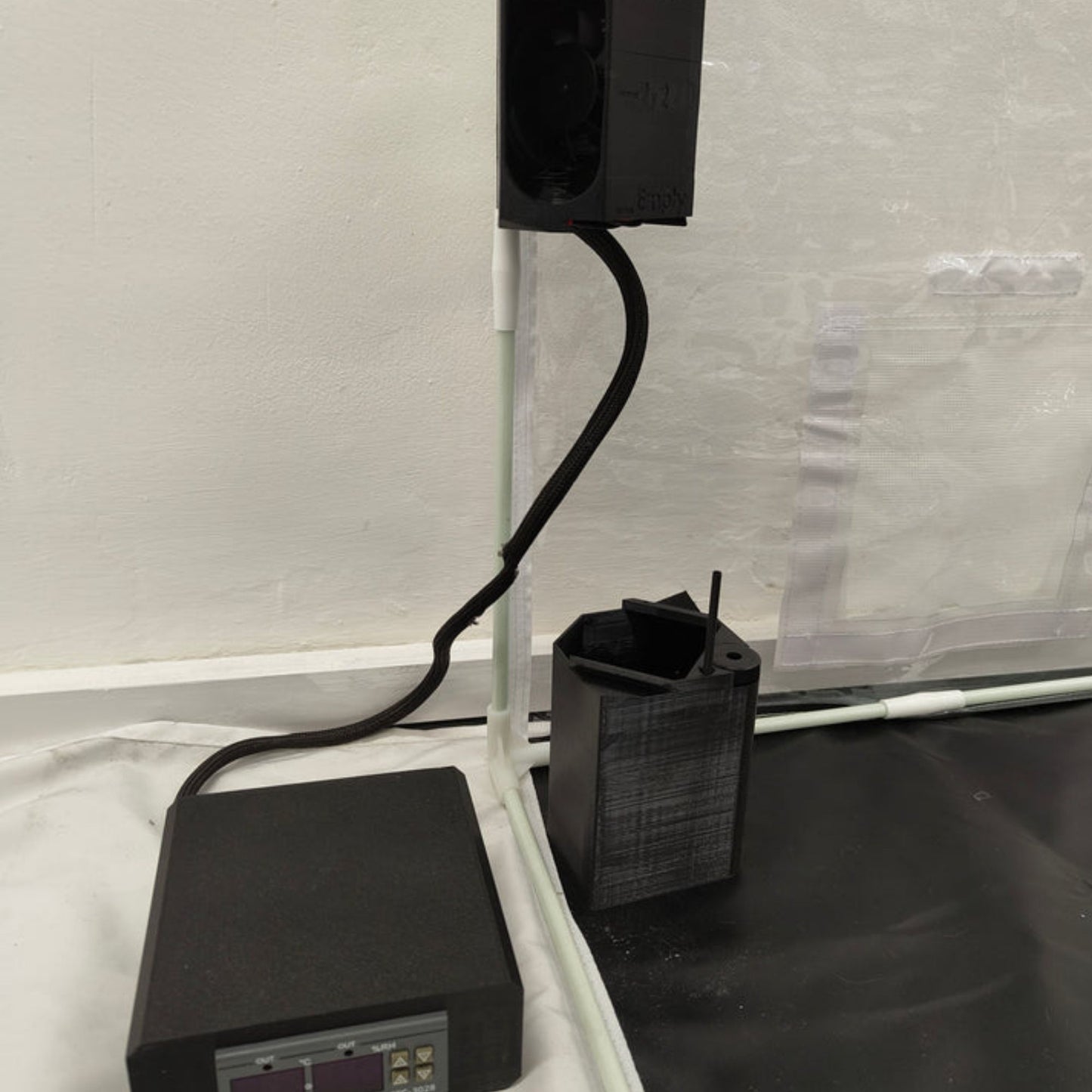 black humidifier, tank and automation controls inside funguy equipment monotub